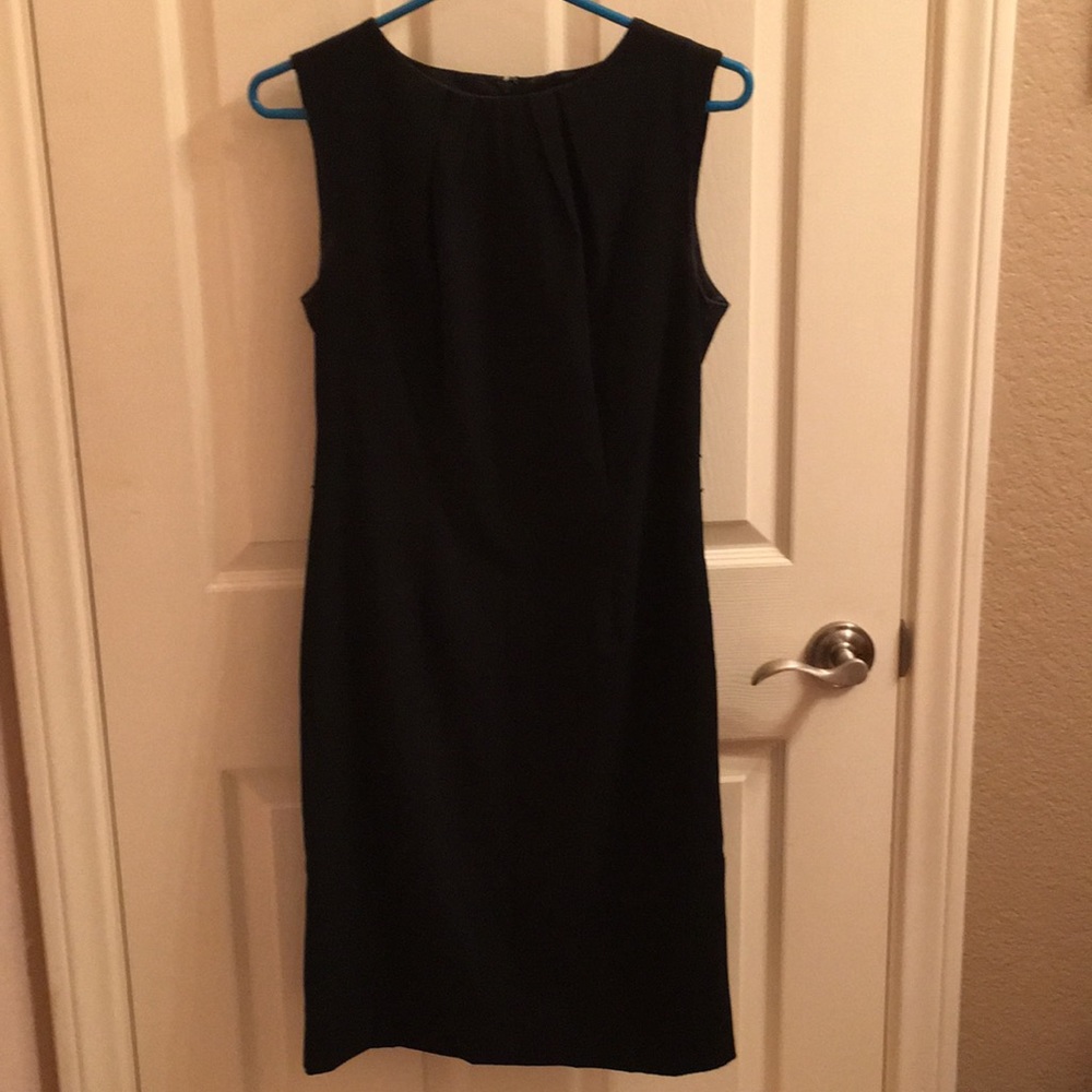 Sleeveless black sheath dress